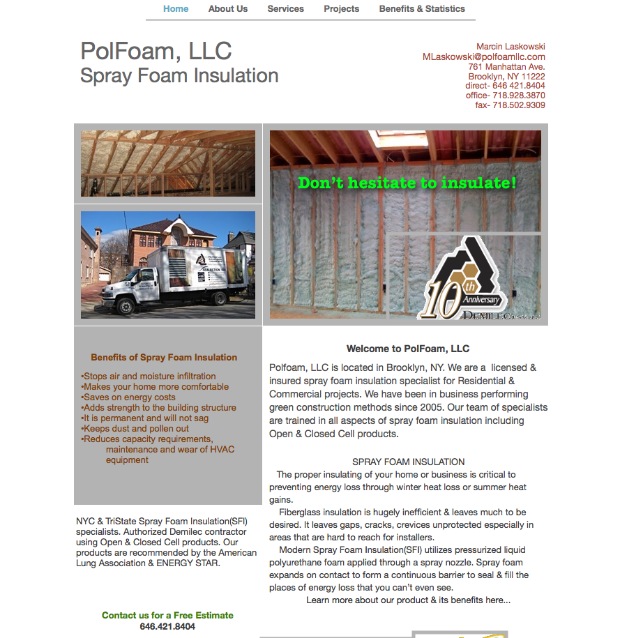 Interior view of attic roof frame with spray foam insulation applied between wooden beams